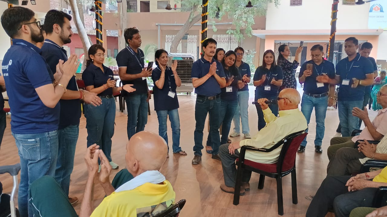 Employees participating in corporate volunteer programs in India, spending time with elders and supporting community care through VridhCare.